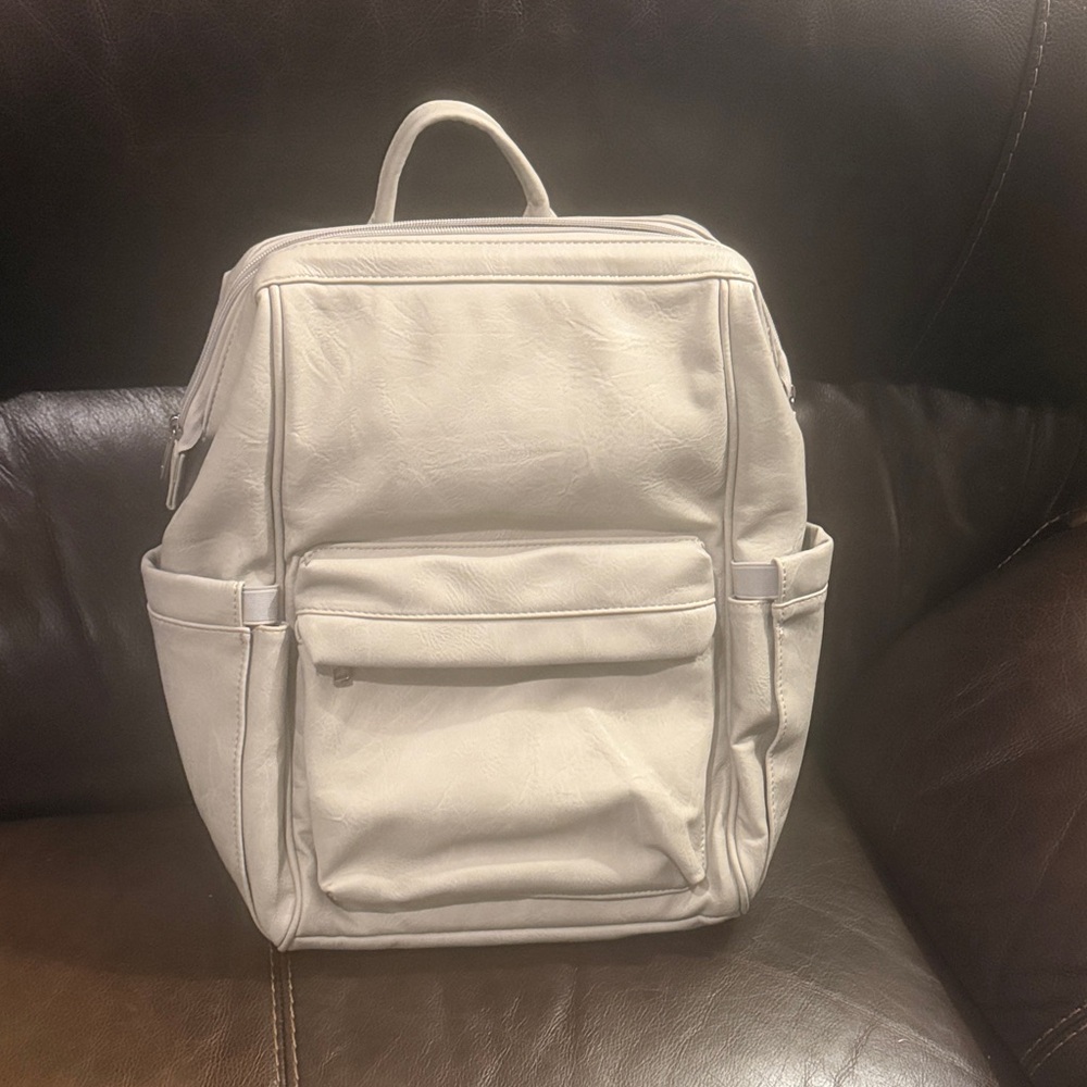 Light grey faux leather backpack / diaper bag with changing pad
